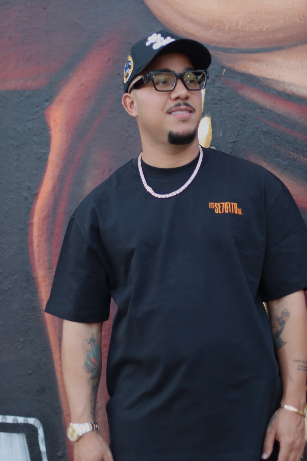 black t-shirt with orange logo