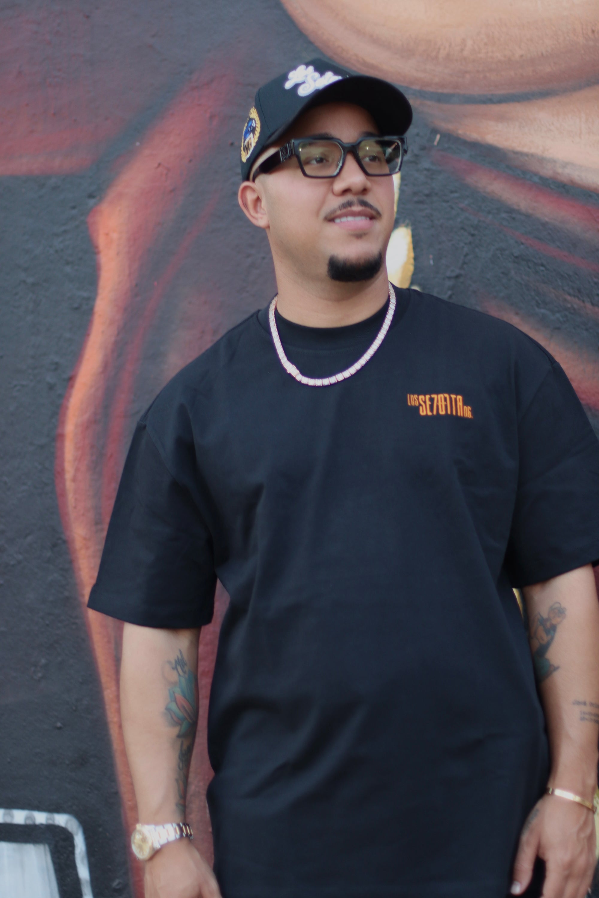 black t-shirt with orange logo