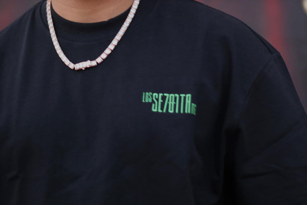 Black t-shirt with green logo