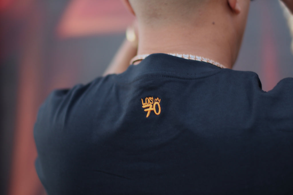 black t-shirt with orange logo